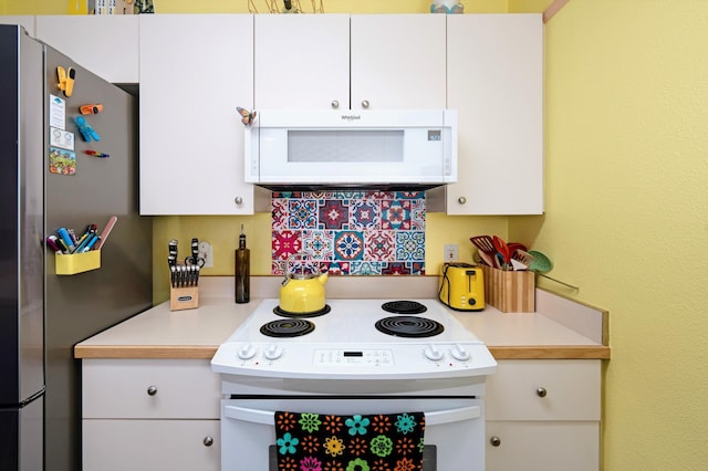 kitchen with white cabinets and white appliances