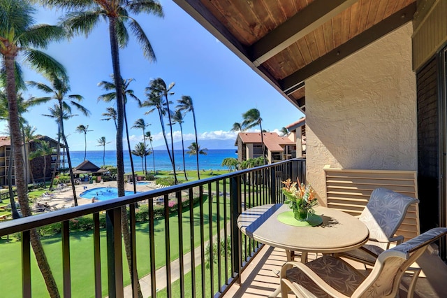 balcony featuring a water view