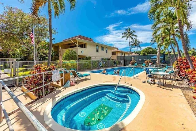 view of swimming pool with a patio