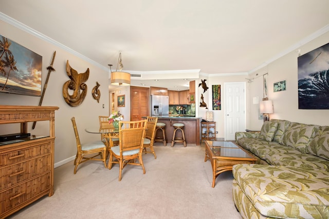 living room with light carpet, baseboards, and crown molding