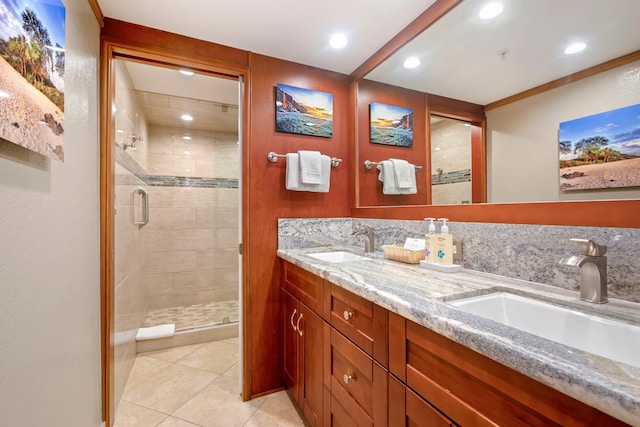 full bathroom with a stall shower, a sink, and tile patterned floors