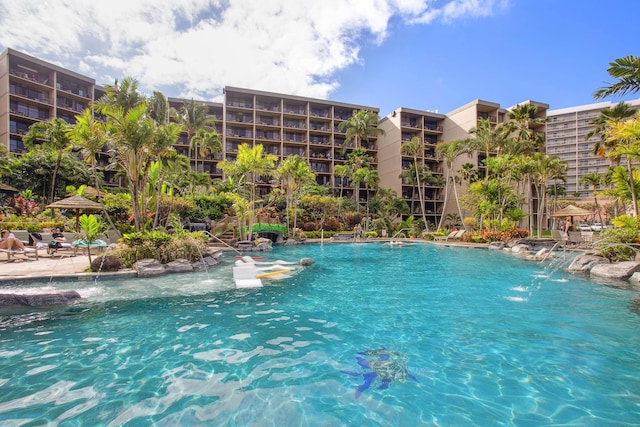 community pool with a patio area