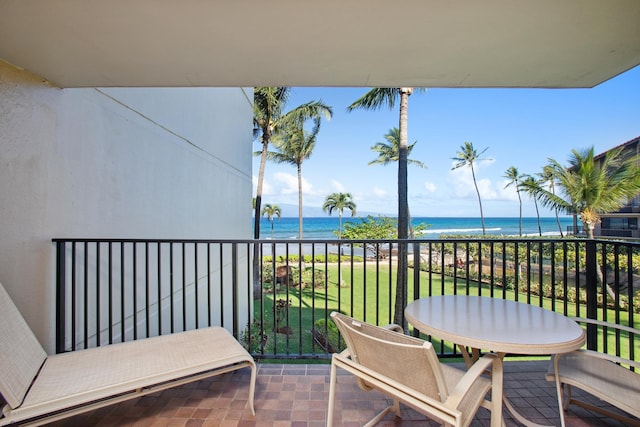 balcony featuring a water view