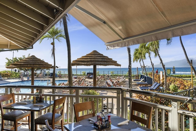 balcony featuring a water view