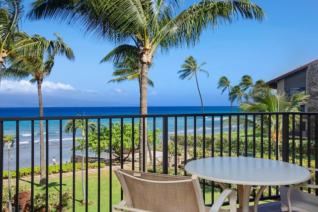 balcony featuring a water view