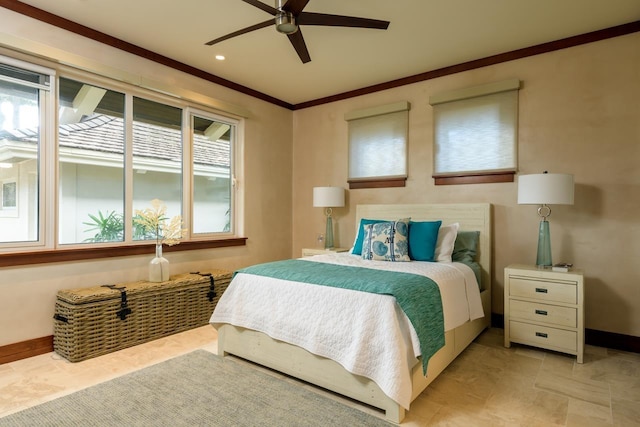 bedroom featuring ceiling fan and crown molding