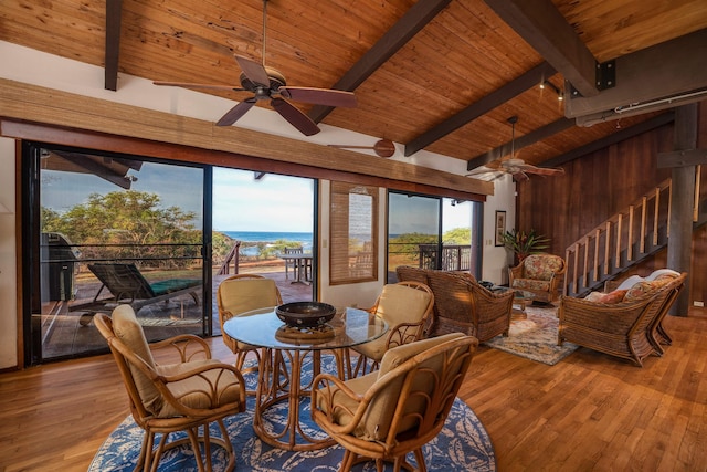 dining area featuring hardwood / wood-style floors, wooden ceiling, ceiling fan, and vaulted ceiling with beams