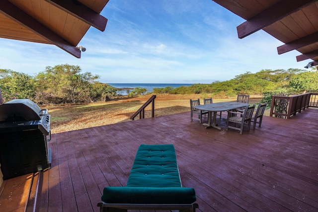 wooden deck featuring a water view