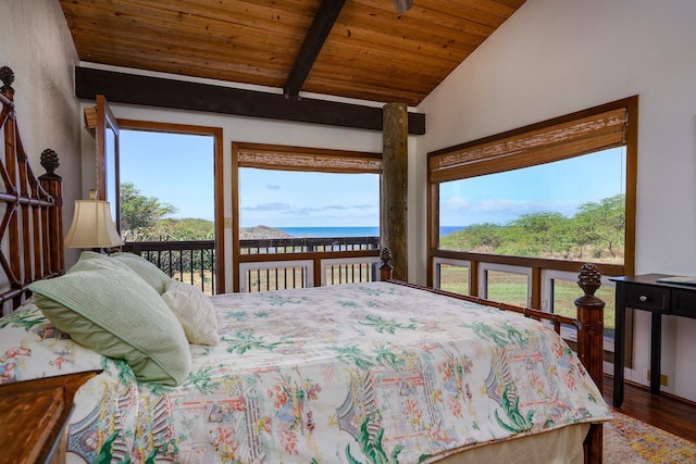 bedroom featuring wooden ceiling, hardwood / wood-style flooring, vaulted ceiling with beams, and multiple windows