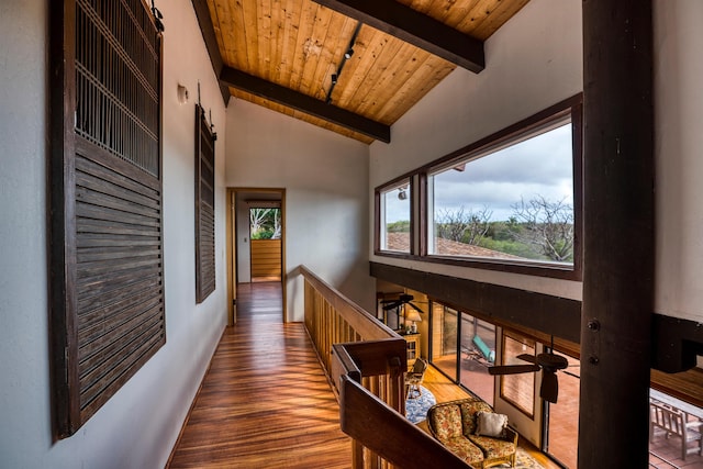 hallway with wooden ceiling, beam ceiling, dark hardwood / wood-style flooring, and high vaulted ceiling