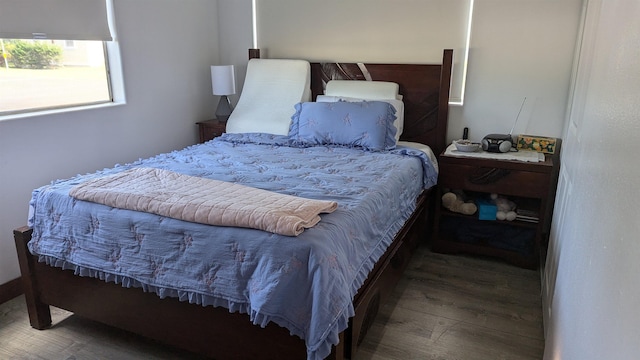 bedroom with hardwood / wood-style flooring