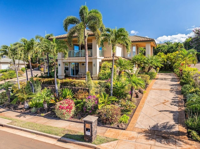 mediterranean / spanish-style home with a balcony