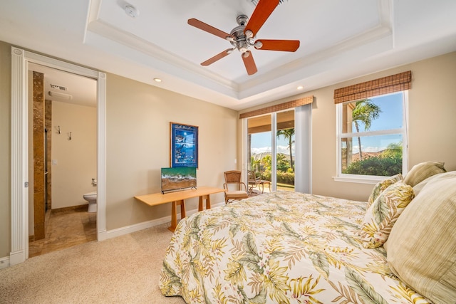 carpeted bedroom with access to outside, a tray ceiling, and ceiling fan