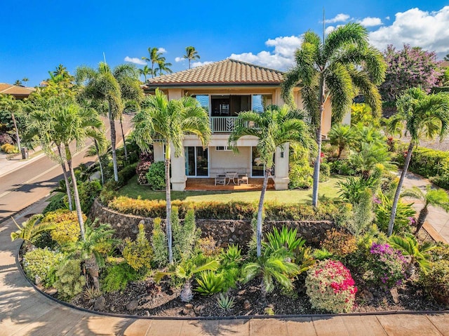 mediterranean / spanish-style home featuring a balcony