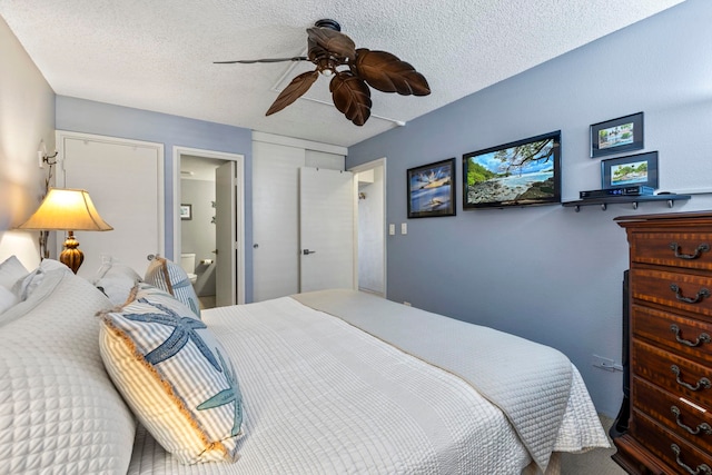 bedroom with connected bathroom, ceiling fan, and a textured ceiling