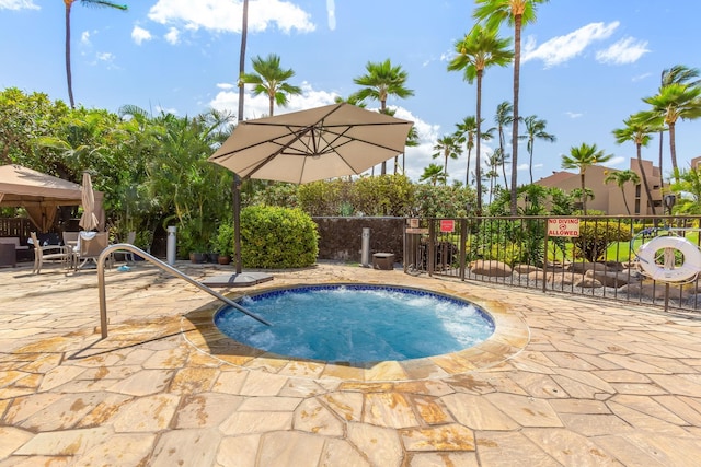 view of pool featuring a hot tub and a patio