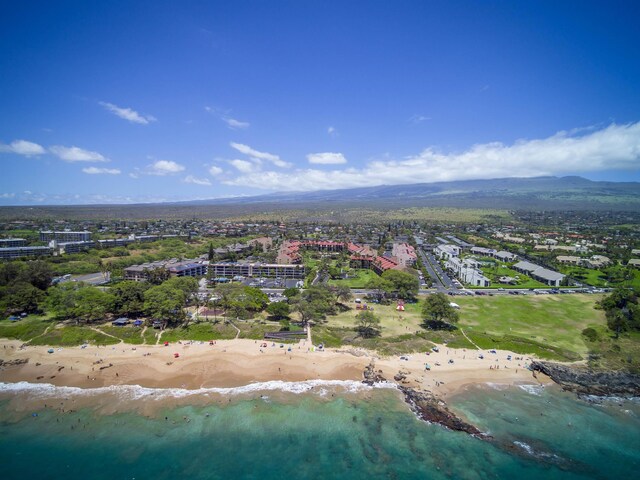 aerial view featuring a view of the beach and a water view