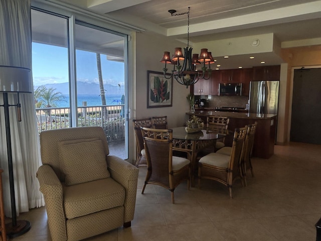 2481 Kaanapali Pkwy Unit 101A, Lahaina, HI 96761 - dining room featuring a chandelier, light tile patterned floors, and a water and mountain view