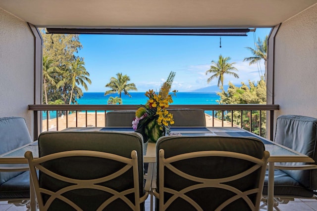 balcony featuring a water view