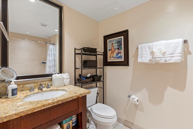 bathroom featuring vanity, toilet, curtained shower, and tile patterned flooring