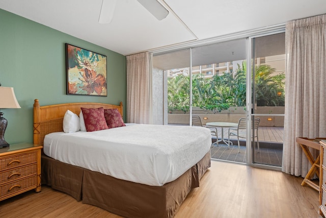 bedroom with access to exterior, ceiling fan, light hardwood / wood-style floors, and floor to ceiling windows