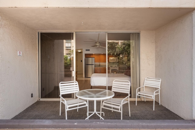 view of patio featuring ceiling fan