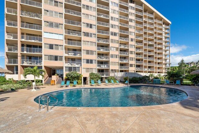 view of swimming pool with a patio area