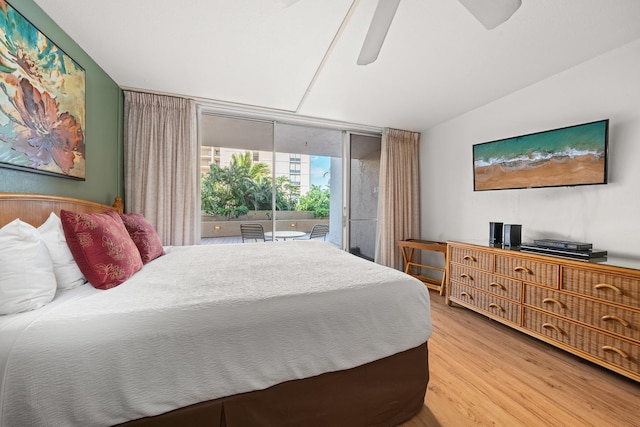 bedroom with wood-type flooring, access to exterior, expansive windows, and ceiling fan