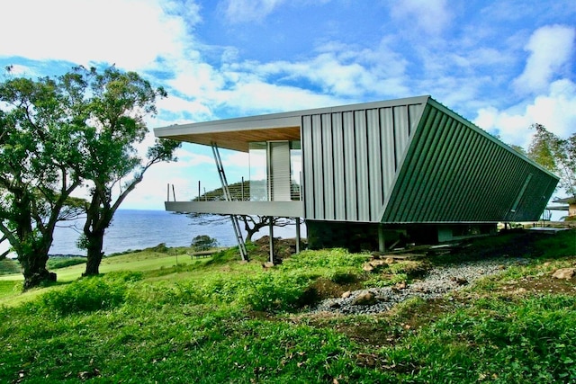 view of home's exterior featuring a water view