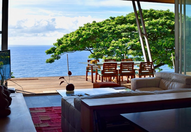 wooden terrace featuring a water view