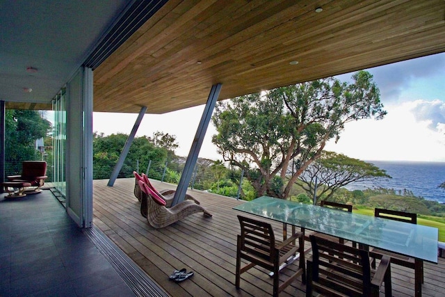 wooden deck featuring a water view