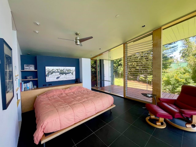 bedroom featuring tile patterned flooring, access to exterior, ceiling fan, and multiple windows