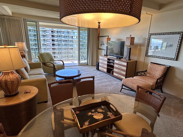 carpeted living room featuring plenty of natural light