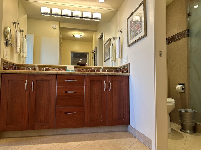 full bath featuring tile patterned flooring, double vanity, and toilet