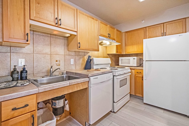 4327 Lower Honoapiilani Rd Unit 101B, Lahaina, HI 96761 - kitchen with white appliances, a sink, under cabinet range hood, light countertops, and decorative backsplash