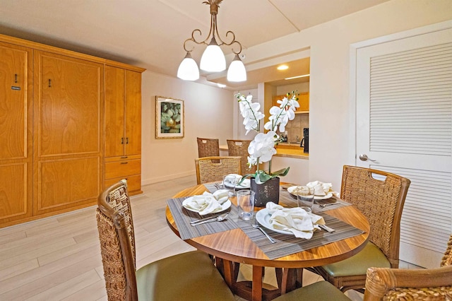 4327 Lower Honoapiilani Rd Unit 101B, Lahaina, HI 96761 - dining area featuring light wood-style flooring and baseboards