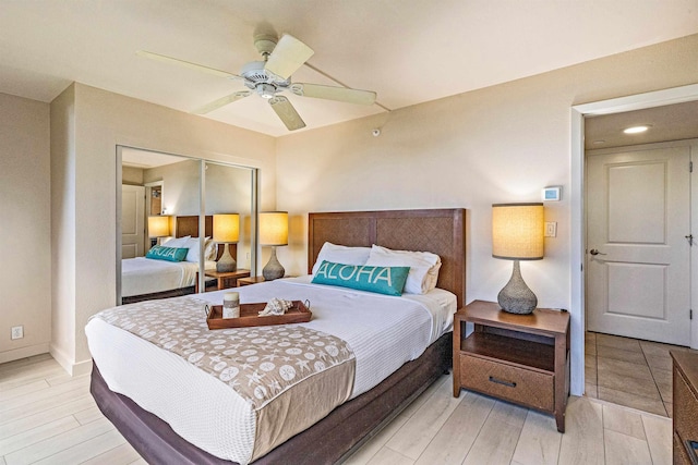 4327 Lower Honoapiilani Rd Unit 101B, Lahaina, HI 96761 - bedroom featuring light wood-style floors, baseboards, and ceiling fan