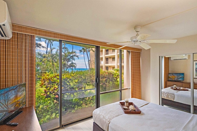 4327 Lower Honoapiilani Rd Unit 101B, Lahaina, HI 96761 - bedroom featuring a wall unit AC and a ceiling fan