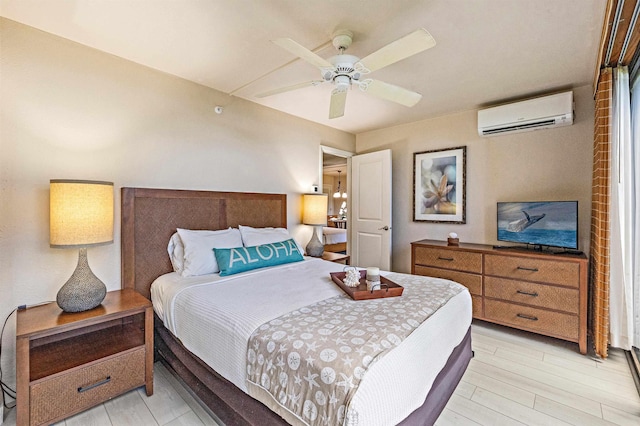 4327 Lower Honoapiilani Rd Unit 101B, Lahaina, HI 96761 - bedroom with a wall mounted air conditioner, light wood-style flooring, and ceiling fan