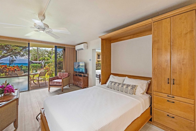 4327 Lower Honoapiilani Rd Unit 101B, Lahaina, HI 96761 - bedroom with a wall unit AC, access to exterior, light wood finished floors, a wall of windows, and ceiling fan