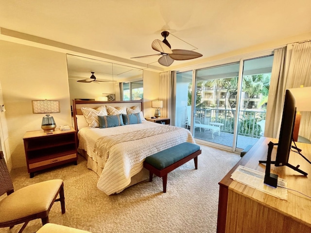 carpeted bedroom with ceiling fan, access to outside, and multiple windows