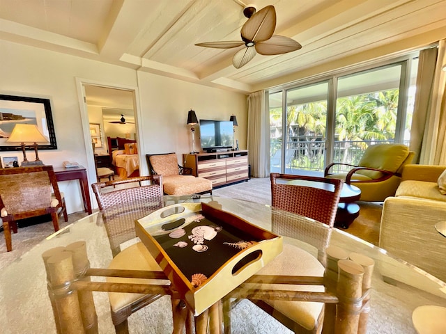 carpeted living room featuring ceiling fan