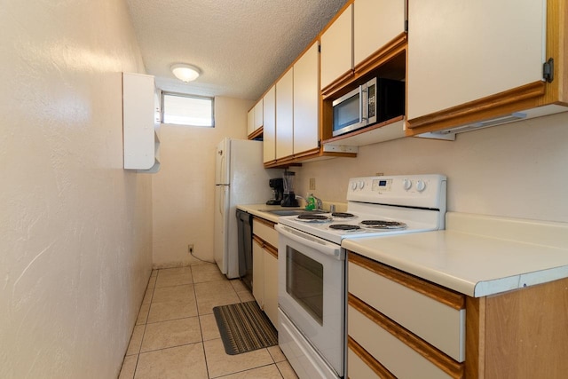 kitchen featuring black dishwasher, a textured ceiling, light tile patterned flooring, electric range, and white cabinetry