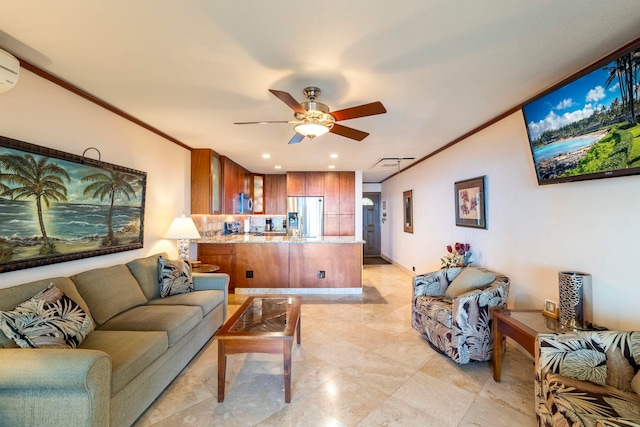 living room with a wall mounted AC, crown molding, and ceiling fan