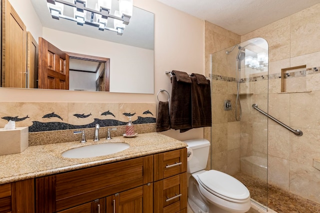 bathroom featuring vanity, toilet, and walk in shower