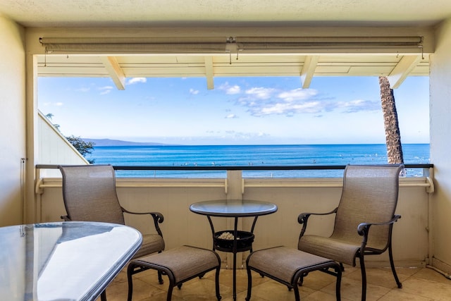 balcony featuring a water view