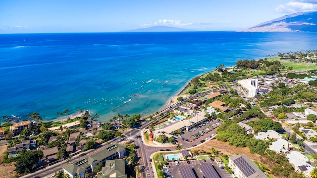 aerial view featuring a water and mountain view