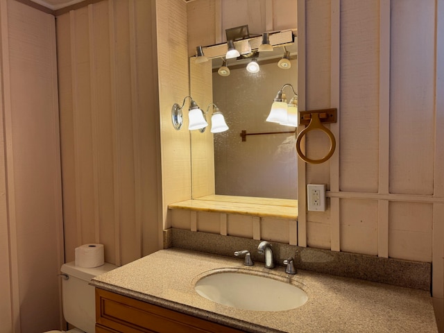 bathroom with toilet and vanity