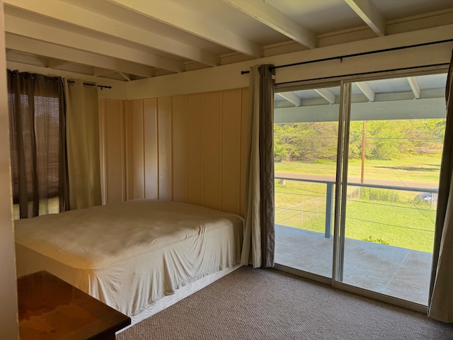 unfurnished bedroom featuring light colored carpet, access to outside, and beamed ceiling