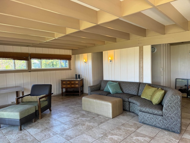 living room featuring beam ceiling and light tile flooring